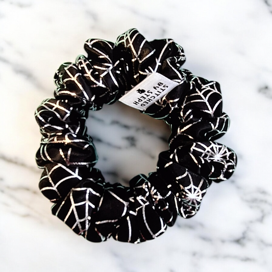 Black scrunchie with silver foil spiderweb design